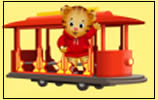 A cartoon tiger wearing a red hoodie waves while riding on a red trolley with yellow trim against a yellow background.