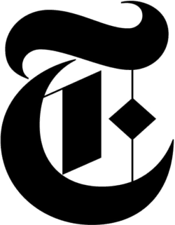 Black New York Times “T” logo in a gothic serif style, featuring a large curved letter “T” with decorative elements and bold geometric shapes on a transparent background.